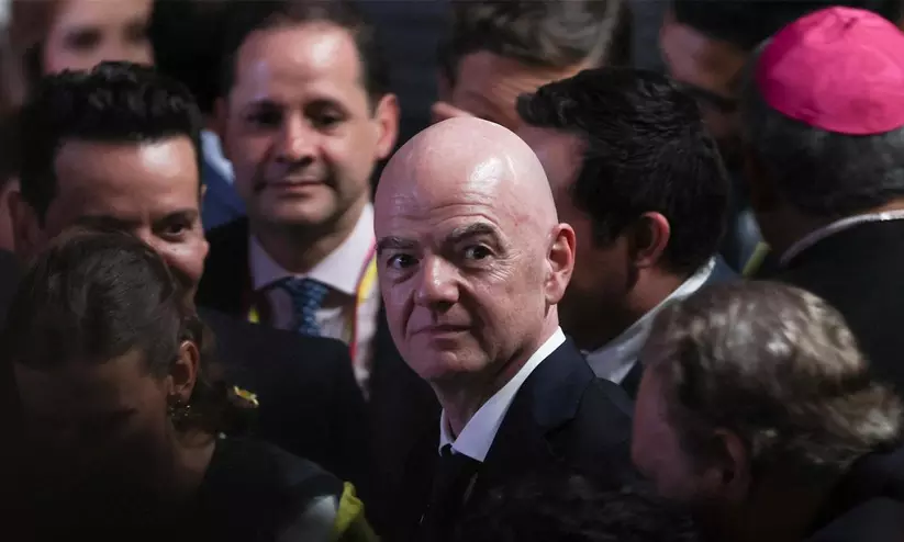 FIFA President Gianni Infantino at an official press briefing discussing tournament commercial rights and administration FIFA President Gianni Infantino at an official press briefing discussing tournament commercial rights and administration