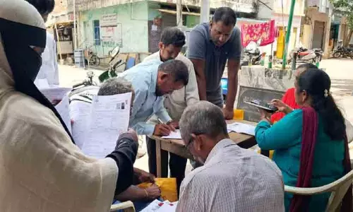 Election Commission officer verifying electoral roll documents in Telangana
