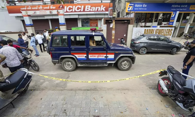 Crime scene and police investigation in Lucknow double murder case involving bank employees. Crime scene and police investigation in Lucknow double murder case involving bank employees.