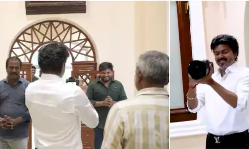 Tamil Nadu Chief Minister Vijay holding a professional camera and clicking photos of press photographers at the Secretariat. Tamil Nadu Chief Minister Vijay holding a professional camera and clicking photos of press photographers at the Secretariat.