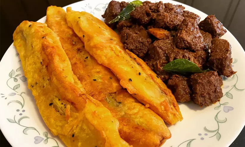 Traditional Kozhikode Pazhampori and Beef curry combo featured in BBC News India documentary. Traditional Kozhikode Pazhampori and Beef curry combo featured in BBC News India documentary.