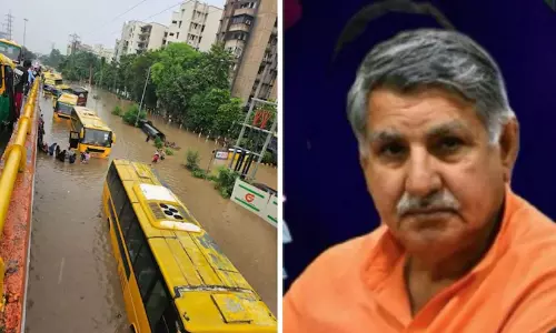 Waterlogged roads and submerged vehicles in Gurugram amid monsoon rains.