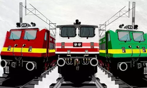 Different coloured Indian Railways train coaches including blue ICF, red LHB and white Vande Bharat.