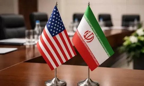 Diplomatic flags and official representation of Iran and US relations amidst geopolitical crisis.