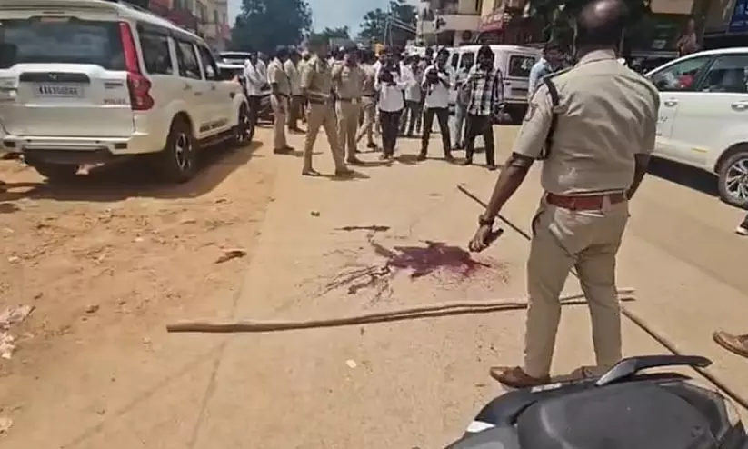 Police tape at the crime scene in Hubballi, Karnataka following broad daylight murder. Police tape at the crime scene in Hubballi, Karnataka following broad daylight murder.