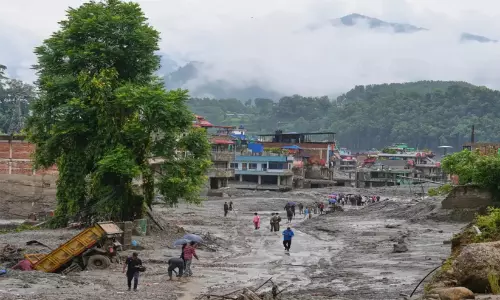 Devastation caused by Nepal flash floods and rescue efforts in the Himalayan region.