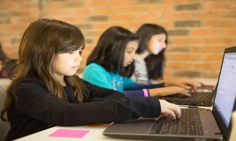 Students in a New York City public school classroom representing the ban on AI tools and screen time limits. Students in a New York City public school classroom representing the ban on AI tools and screen time limits.