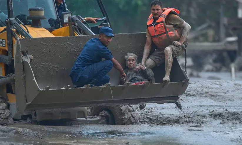 91-year-old Nepal flood survivor Guna Maya Bohara recovering after being rescued from rubble. 91-year-old Nepal flood survivor Guna Maya Bohara recovering after being rescued from rubble.