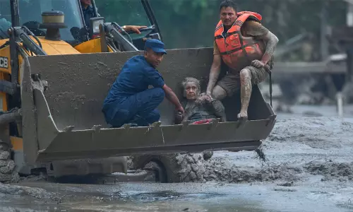 91-year-old Nepal flood survivor Guna Maya Bohara recovering after being rescued from rubble.