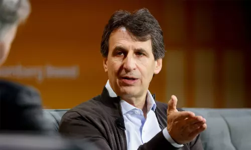 Billionaire Marc Rowan speaking at an international conference.