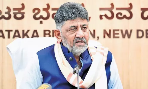 Karnataka Chief Minister DK Shivakumar addressing the media during a press conference in Bengaluru.