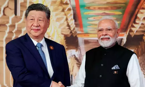 Prime Minister Narendra Modi shaking hands with Chinese President Xi Jinping during bilateral talks at Bharat Mandapam in New Delhi.