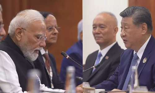 Prime Minister Narendra Modi addressing the BRICS Summit in New Delhi with Chinese President Xi Jinping in attendance.