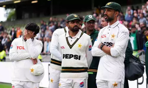 The Pakistan cricket team walking off the field after a series defeat in England