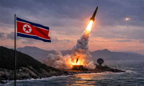 North Korea test-firing a projectile off its eastern coastline into the sea.