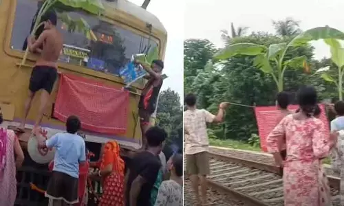 ഓടിക്കൊണ്ടിരുന്ന ട്രെയിൻ നിർത്തിച്ച് എൻജിനിൽ പൂജ നടത്തി! ബംഗാളിൽ നിന്നും വിചിത്ര കാഴ്ച