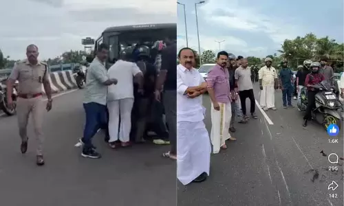Kerala opposition leader V.D. Satheesan assisting an injured biker involved in a road accident on the Kochi Container Terminal Road Kerala opposition leader V.D. Satheesan assisting an injured biker involved in a road accident on the Kochi Container Terminal Road