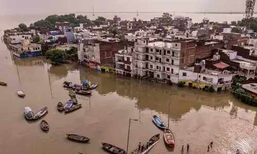 NDRF and SDRF rescue boats operating in inundated areas during the Bihar flood crisis.