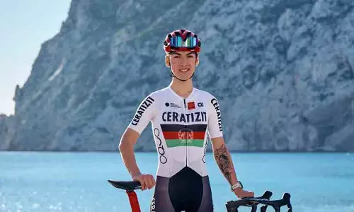 Afghan female cyclist Fariba Hashmi celebrating her silver medal win at the Asian Games in Nagoya, Japan