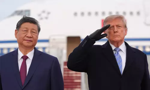 US President Donald Trump and Chinese President Xi Jinping greeting each other on the red carpet at Joint Base Andrews.