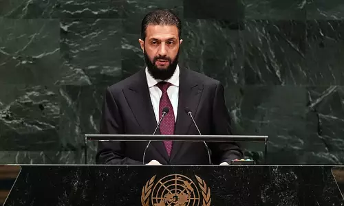 Syrias interim president Ahmad al-Sharaa speaking at the United Nations General Assembly podium. Syrias interim president Ahmad al-Sharaa speaking at the United Nations General Assembly podium.