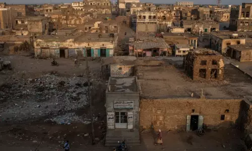 Military conflict smoke rising in Yemen’s coastal front line near Bab al-Mandab Strait.