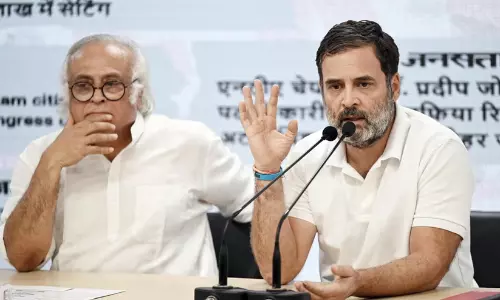 Senior Congress MP and General Secretary Jairam Ramesh addressing the media with Rahul Gandhi at a party press conference in New Delhi.