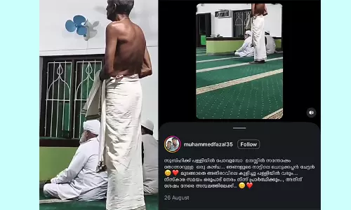 Cherukkappan Chettan praying respectfully inside a mosque while worshippers offer morning Subhi prayers in Kerala. Cherukkappan Chettan praying respectfully inside a mosque while worshippers offer morning Subhi prayers in Kerala.