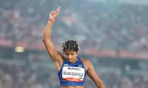 Ancy Sojan celebrating her silver medal win in the womens long jump event at the Asian Games.