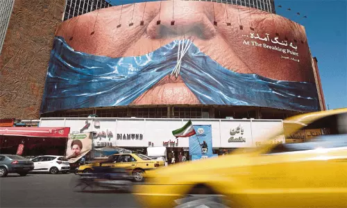 A public billboard depicting the Strait of Hormuz displayed on a building in Tehran. A public billboard depicting the Strait of Hormuz displayed on a building in Tehran.