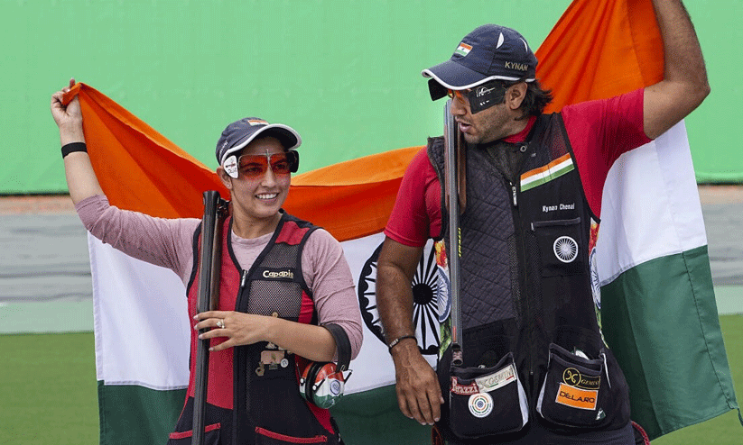 Neeru Dhanda and Kynan Chenai celebrating their gold medal win and setting a new Asian record in trap shooting at the Asian Games Neeru Dhanda and Kynan Chenai celebrating their gold medal win and setting a new Asian record in trap shooting at the Asian Games