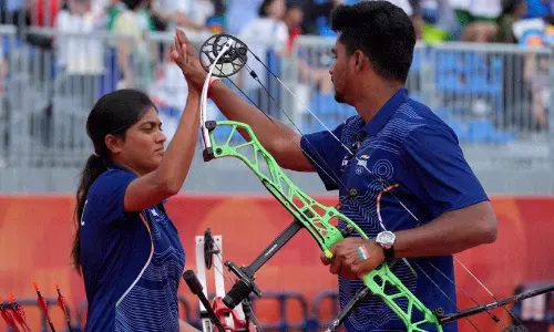 Indian archery mixed team Sahil and Chikitah celebrating their gold medal win and Olympic qualification at the Asian Games Indian archery mixed team Sahil and Chikitah celebrating their gold medal win and Olympic qualification at the Asian Games