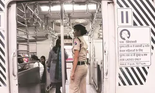 RPF personnel conducting security checks near the reserved ladies coach of a passenger train. RPF personnel conducting security checks near the reserved ladies coach of a passenger train.