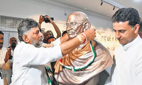 Karnataka Chief Minister DK Shivakumar paying floral tributes during the Gandhi Jayanti celebrations in Bengaluru.