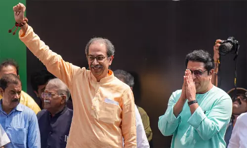 Shiv Sena (UBT), MNS and NCP (SP) supporters carrying the Tricolour during the Virat Garjana Morcha rally against CEC Gyanesh Kumar in Mumbai.