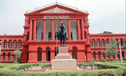 Karnataka High Court building representing the bench order quashing FIR over social media post.