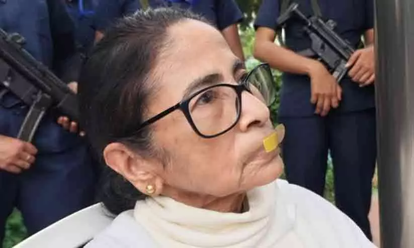 Mamata Banerjee and TMC leaders protesting with bandaged mouths in New Delhi before being detained by police Mamata Banerjee and TMC leaders protesting with bandaged mouths in New Delhi before being detained by police