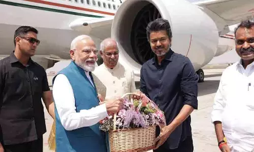 Tamil Nadu Chief Minister C. Joseph Vijay welcoming Prime Minister Narendra Modi at Chennai airport.