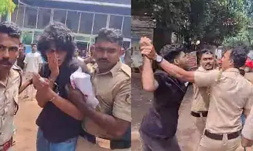 Police personnel handling the tense situation outside the hospital where accused Suhail Sajeev was brought for medical examination