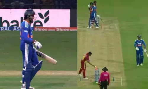 Tilak Varma walking back to the pavilion after a strange run out incident during the India vs West Indies T20I match Tilak Varma walking back to the pavilion after a strange run out incident during the India vs West Indies T20I match