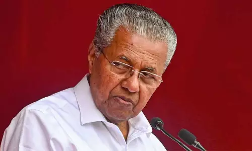 Pinarayi Vijayan speaking at a press conference regarding the dissolution of the Waqf Board