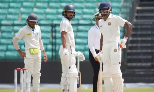 Kerala cricket team players celebrating during the Ranji Trophy match against Odisha at Greenfield Stadium, Thiruvananthapuram