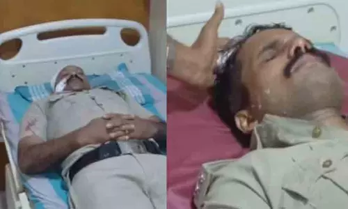 Njarakkal police officers inspecting the crime scene after SI Jithin and constable Ragesh were stabbed near Ernakulam