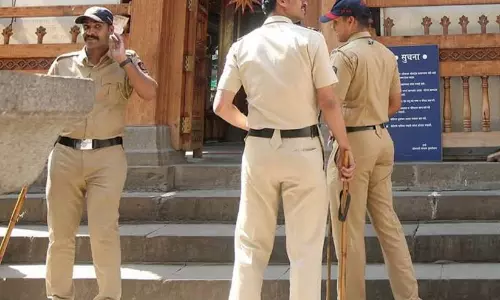 Police personnel outside Jahangirpura Police Station in Surat conducting a probe following the lock-up breach. Police personnel outside Jahangirpura Police Station in Surat conducting a probe following the lock-up breach.
