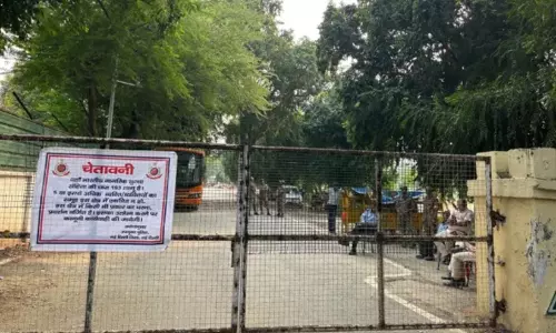Police personnel stationed outside the gated entrance of Race Course Masjid near Lok Kalyan Marg in New Delhi. Police personnel stationed outside the gated entrance of Race Course Masjid near Lok Kalyan Marg in New Delhi.