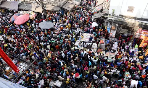 Traders and shoppers in the crowded markets of Chandni Chowk and Sadar Bazar near Ramlila Maidan in Old Delhi.