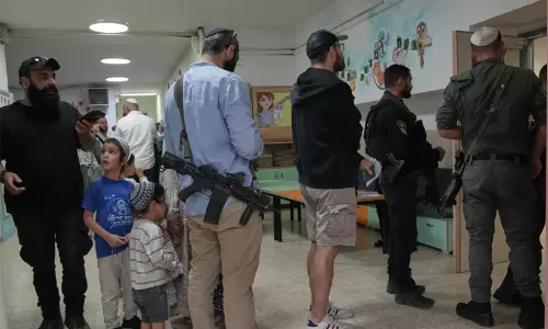 Voters queue outside a polling station in Tel Aviv as Israel records high turnout in the 2026 parliamentary election.