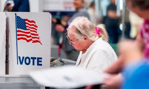 Voters in the United States standing in queue to cast advance ballots at an early voting center.