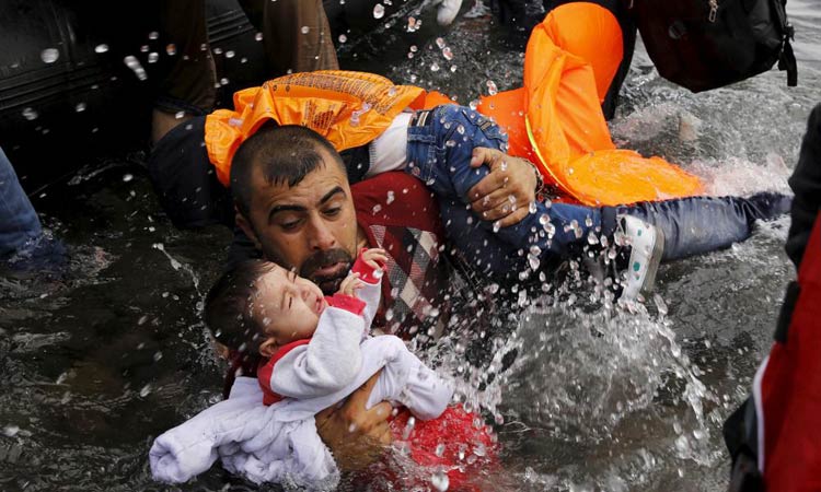 A-Syrian-refugee-holds-his-INFANT