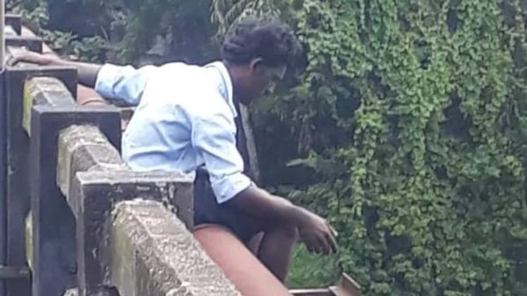 man-tries-to-jump-to-river